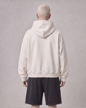 Essential Oversized Hoodie in Off-White, back view on model