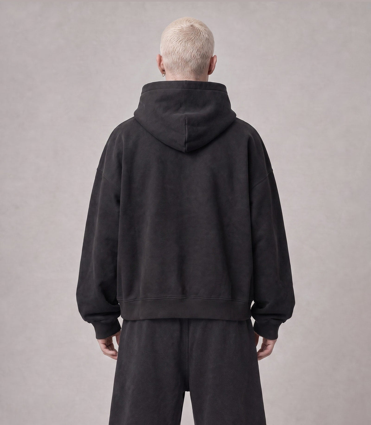 Essential Oversized Hoodie in Black, back view on model