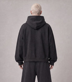 Essential Oversized Hoodie in Black, back view on model
