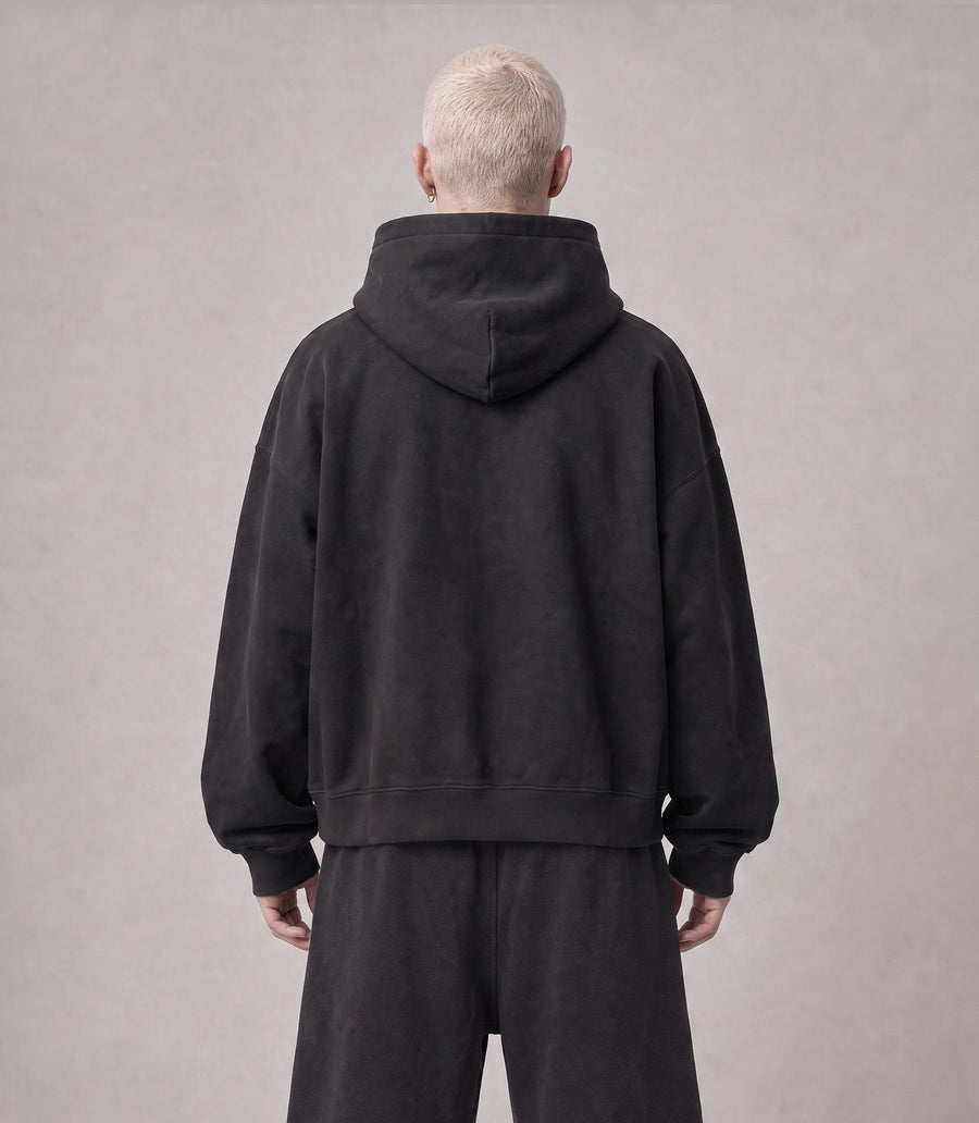 Essential Oversized Hoodie in Black, back view on model
