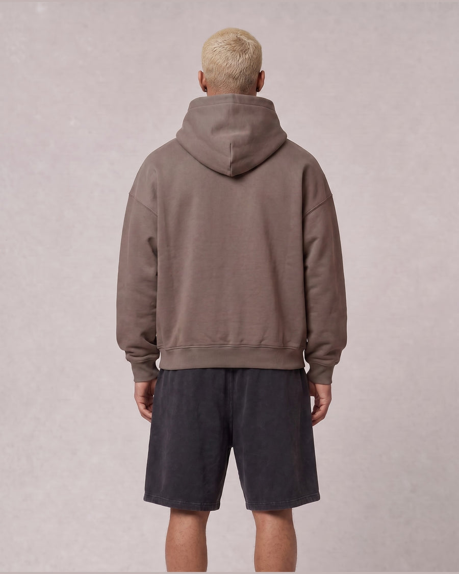 Essential Oversized Hoodie in Brown, back view on model