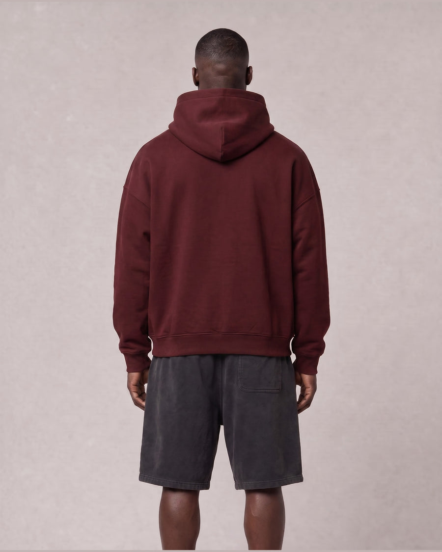 Essential Oversized Hoodie in Dark Red, back view on model