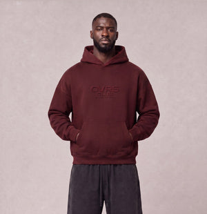 Essential Oversized Hoodie in Dark Red, front view on model