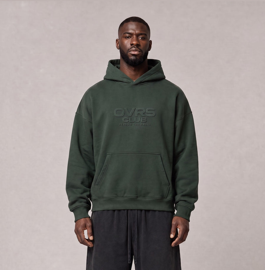Essential Oversized Hoodie in Green, front view on model
